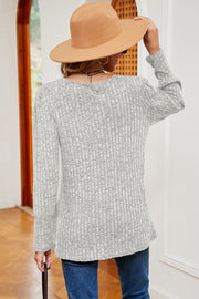 Light gray ribbed button-down top with long sleeves and asymmetric hem.