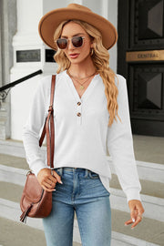 White waffle knit long sleeve top with v-neck and button detail