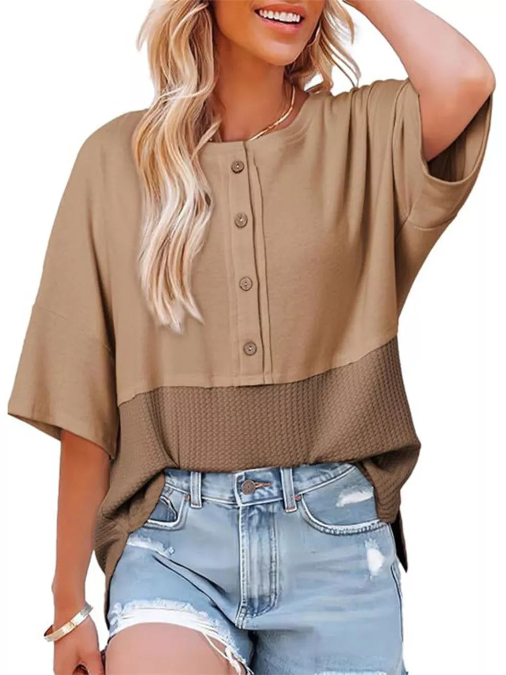 Khaki waffle-knit t-shirt with button detail and textured lower panel.