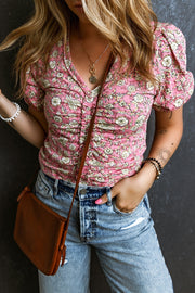 Floral ruched bodice puff sleeve top with a V-neck, styled with jeans and a crossbody bag.