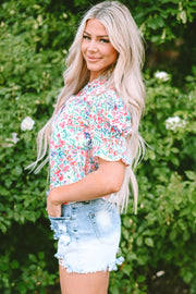 Floral ruffle collar puff sleeve blouse with smocked cuffs.