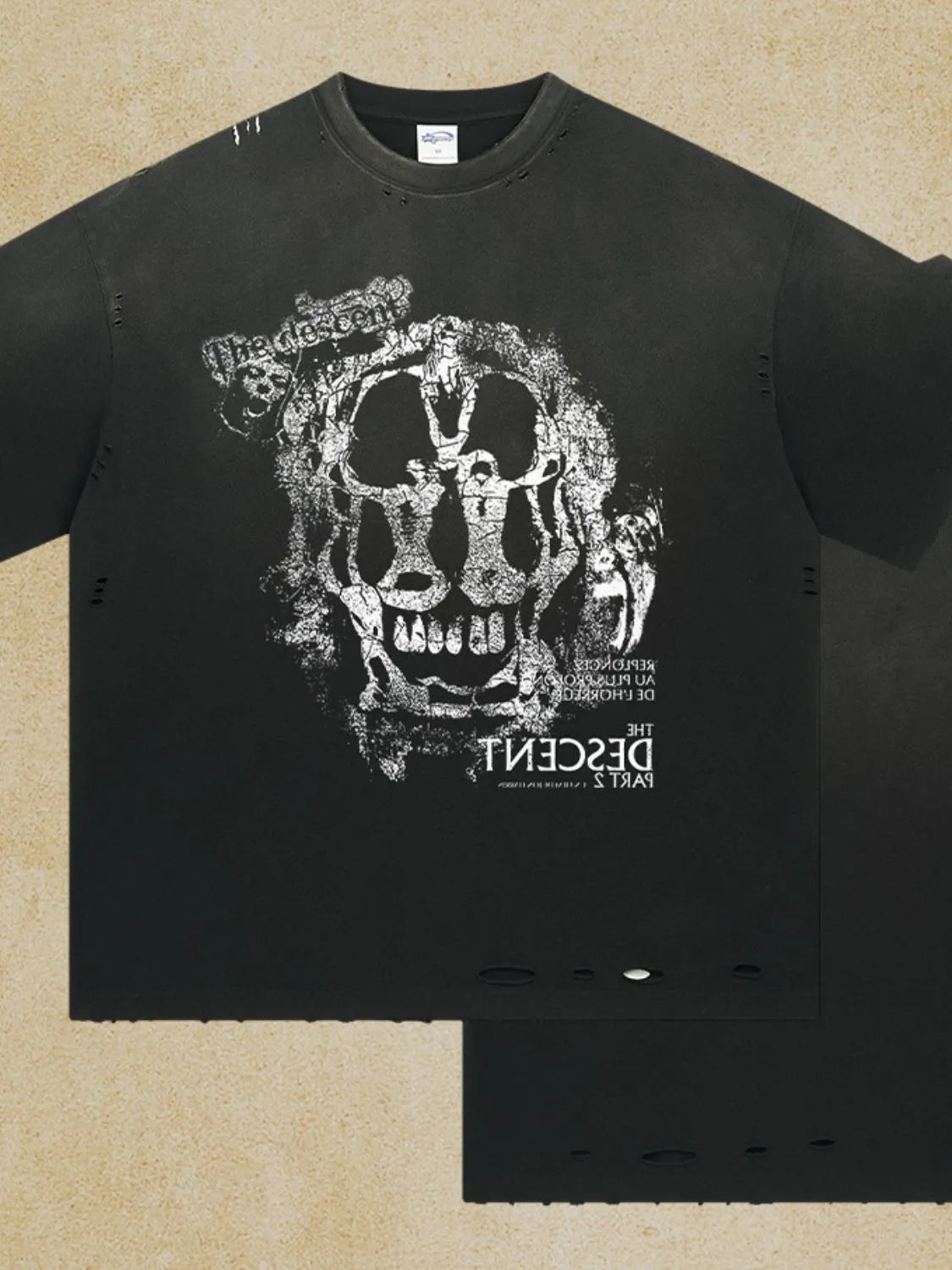 Black distressed graphic tee with skull print and distressed details