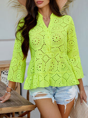 Neon yellow eyelet embroidered peplum blouse with ruffles and buttoned neckline.