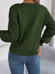 Dark green acrylic sweater with square neckline and textured sleeves.