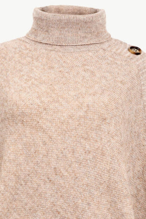 Tan knit poncho with turtleneck and button detail on shoulder