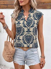 Ornate cap sleeve blouse with notch neckline in blue and cream damask print.