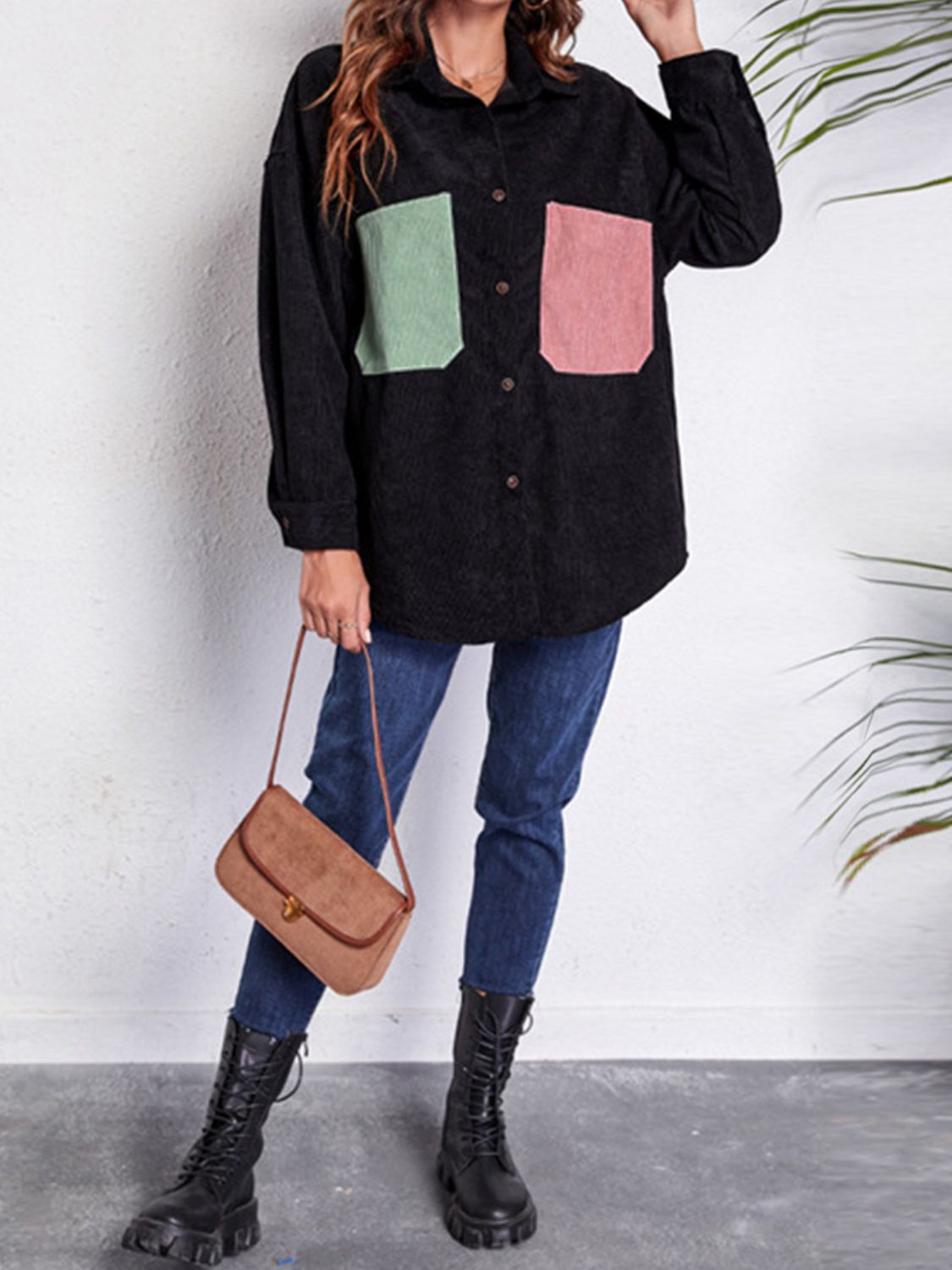 Black corduroy overshirt with contrast pastel patch pockets and button front.