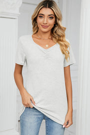 Light grey ruched V-neck jersey tee with short sleeves.