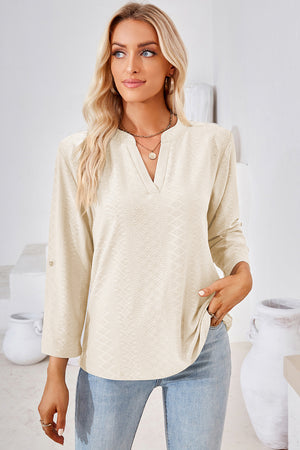 Cream textured henley shirt with V-neck and roll-tab sleeves