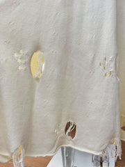 Off white distressed cotton sweater set with deconstructed details and fringe hem