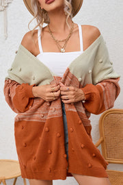 Textured colorblock bobble cardigan in pink and caramel acrylic with a relaxed fit.
