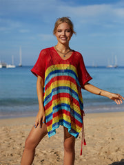 Rainbow stripe crochet beach poncho with V-neck and short sleeves.