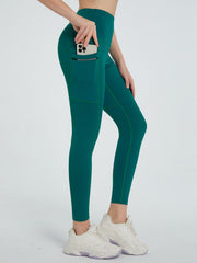 Dark Green Pocketed Sculpt Leggings with contrast stitching and side phone pocket.