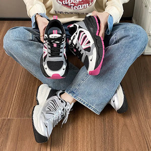 Chunky mesh runner sneakers in hot pink and silver with breathable athletic design.