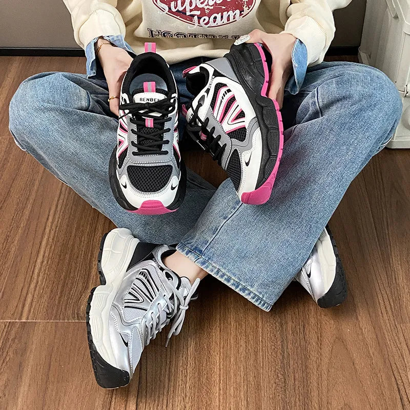 Chunky mesh runner sneakers in hot pink and silver with breathable athletic design.