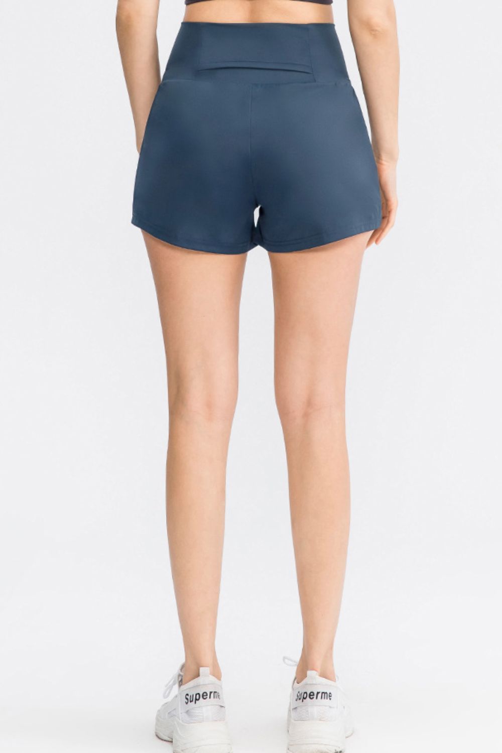 Sculpted high-waist active shorts in Dark Blue with a back pocket detail.