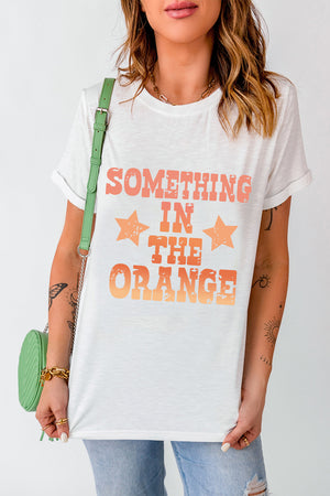White graphic tee with faded orange text and stars, crew neck, short sleeves.