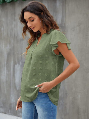 Matcha green Swiss dot blouse with flutter sleeves and V-neck