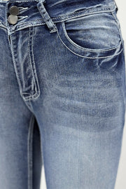 Light wash bootcut jeans with double button closure and white contrast stitching.