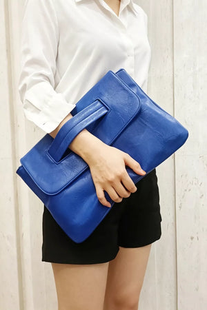 Blue distressed leather envelope clutch with cut-out handle