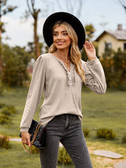 Dust Storm ruffled henley blouse with button placket and long sleeves.