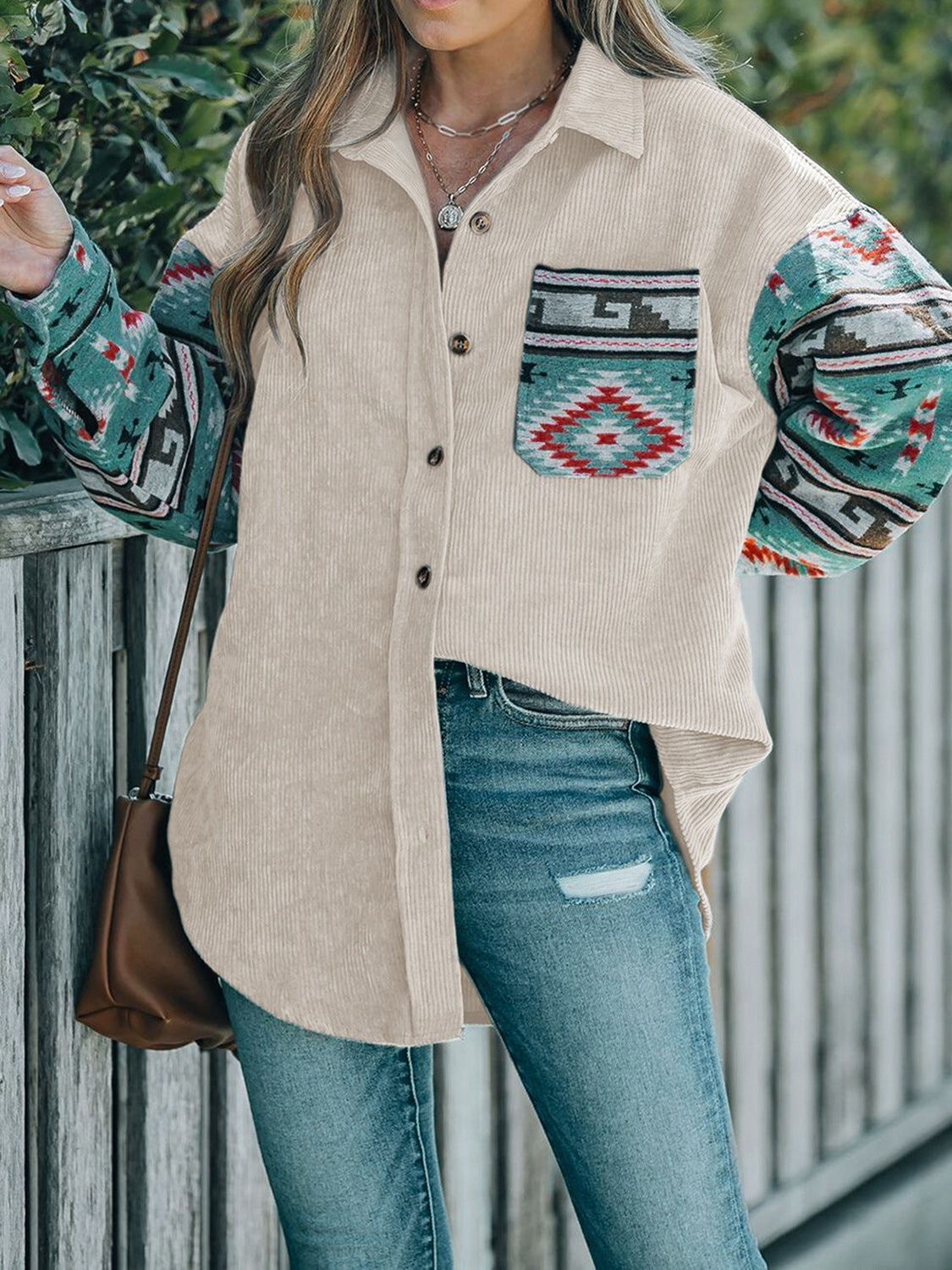 Corduroy shacket in dust storm with Aztec print pocket and sleeves, collared, buttoned front.