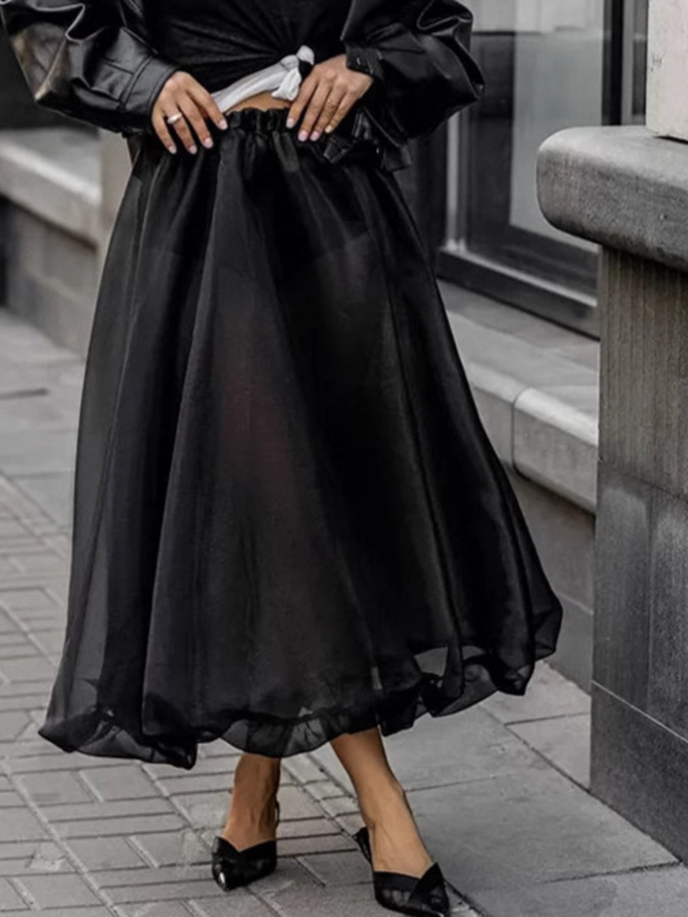 Black midi skirt with sheer overlay and ruffled hem, elastic waist, women's dressy casual style.