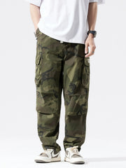 Casual cargo pants in army green camouflage with drawstring and multiple pockets.