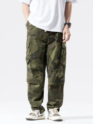Casual cargo pants in army green camouflage with drawstring and multiple pockets.