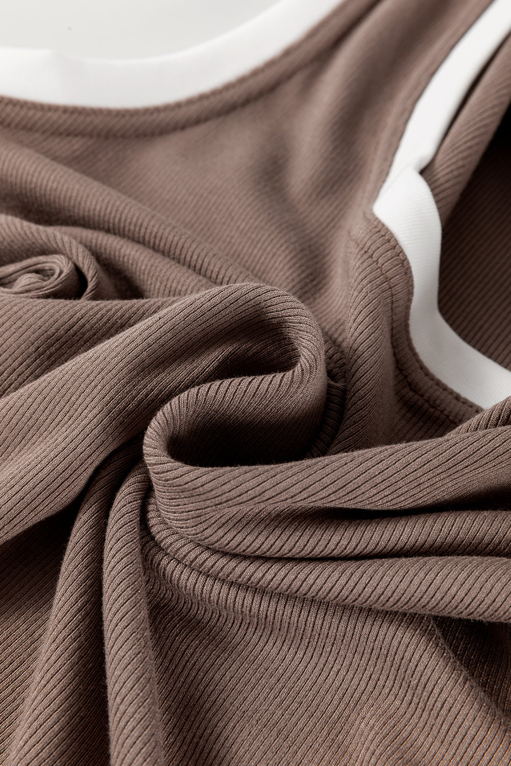 Mocha ribbed knit tank top with contrast white trim and scoop neckline.