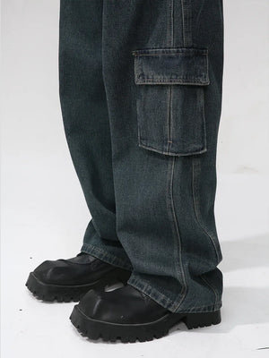 Panelled dark wash denim cargo pants with a large side pocket detail.