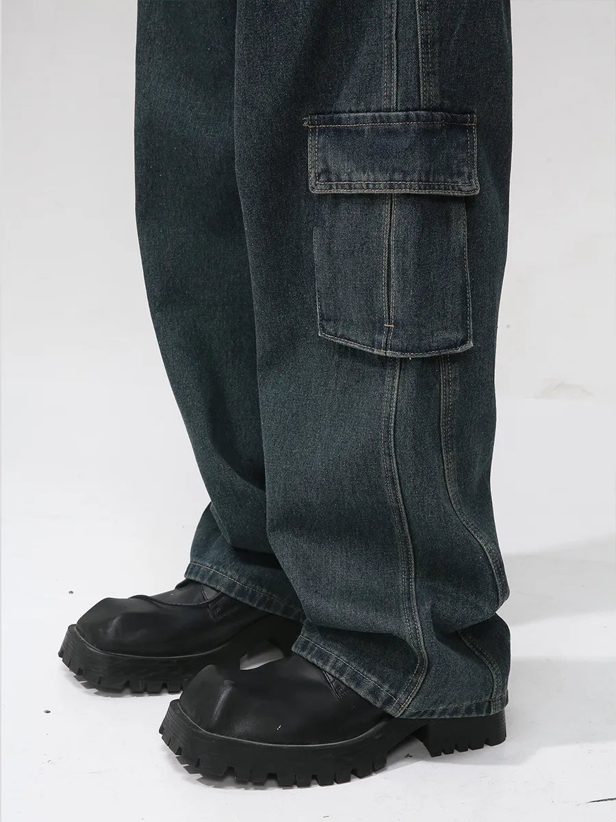 Panelled dark wash denim cargo pants with a large side pocket detail.