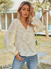 Cream textured puff sleeve v-neck blouse with a casual, basic style.