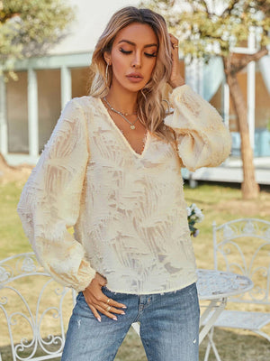 Cream textured puff sleeve v-neck blouse with a casual, basic style.