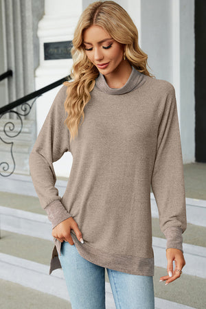 Colorblock raglan turtleneck tunic in camel with a relaxed fit and high-low hem.
