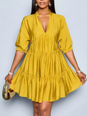 Yellow tiered mini dress with notched V-neck and ruffled sleeves.