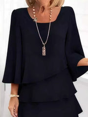 Black ruffled tiered dress with 3/4 bell sleeves and a square neckline.