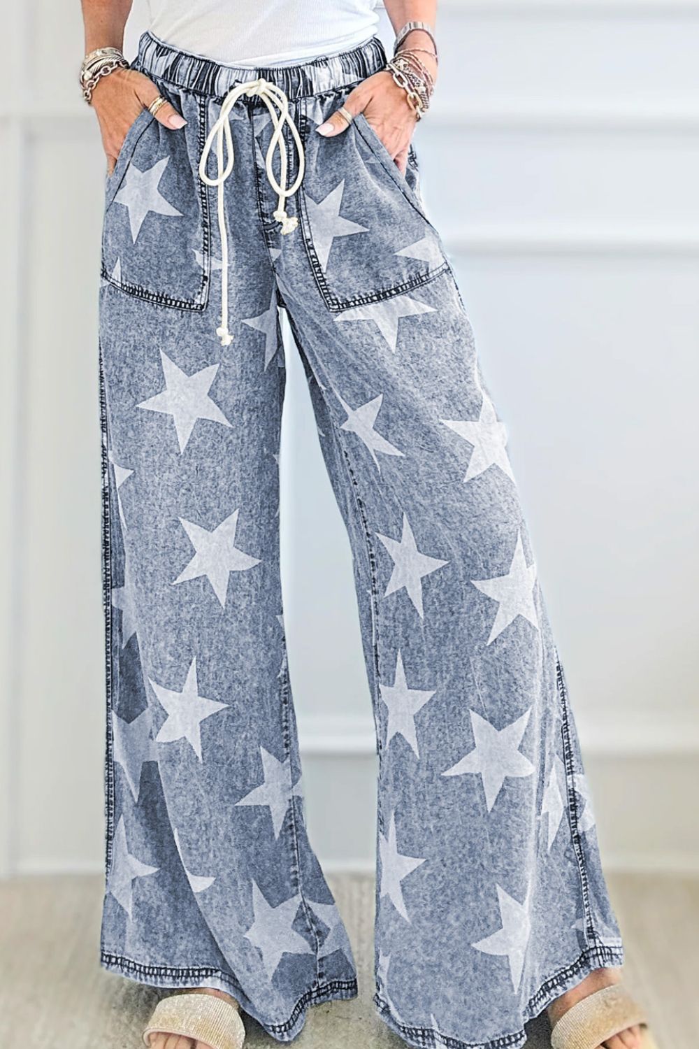 Cosmic Wash Star Print Palazzo Jeans in medium wash denim with a drawstring waist and wide leg