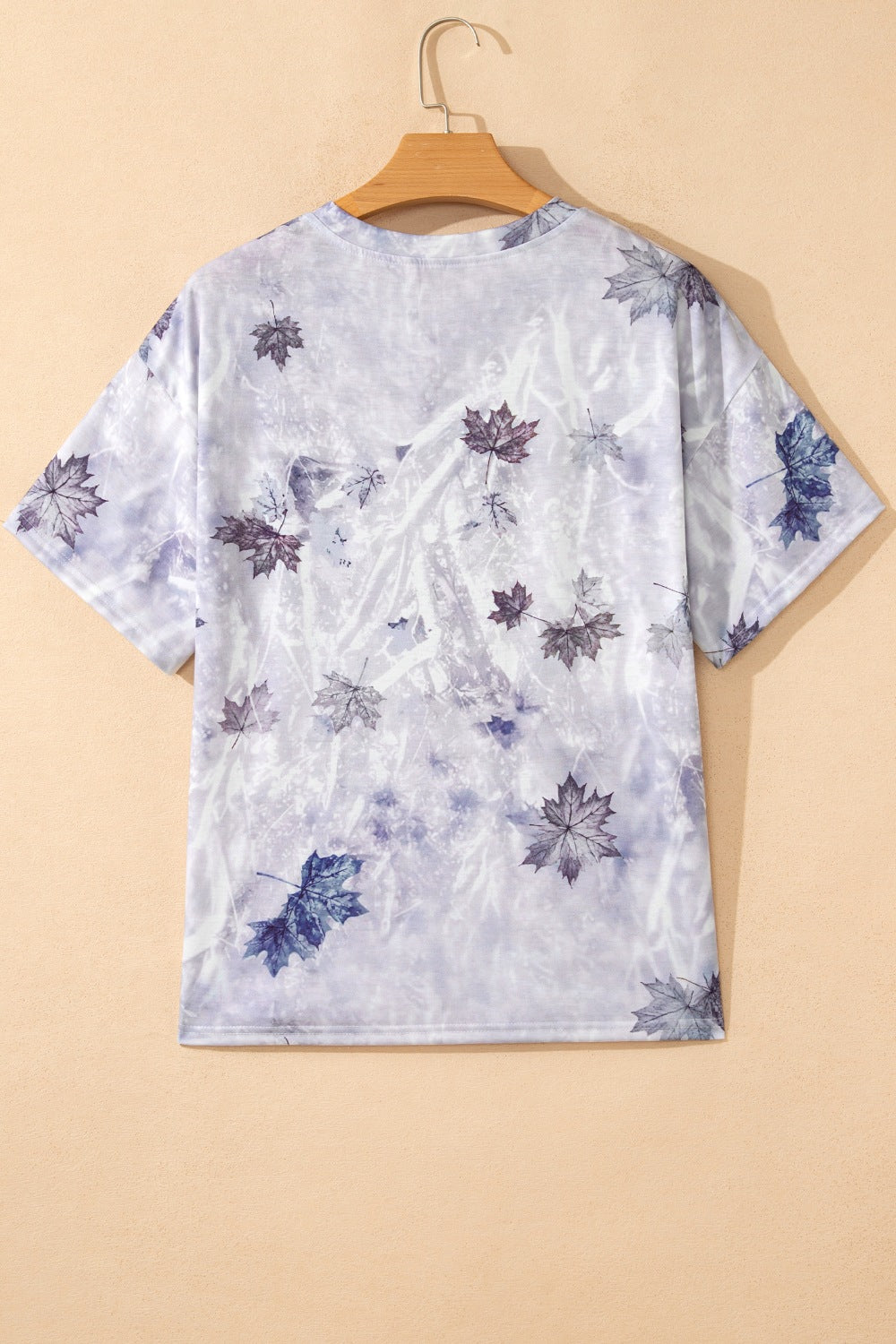Tunic tee with crew neck and short sleeves in a faded purple and blue leaf print.