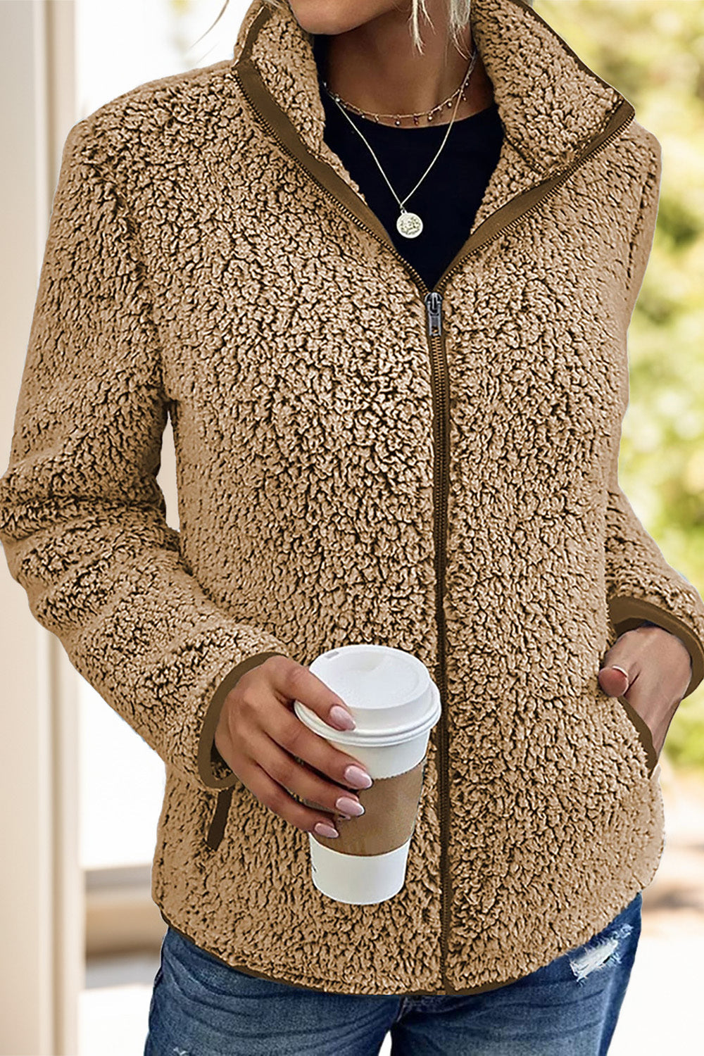 Teddy fleece zip-up jacket in camel with a stand-up collar and zip closure.