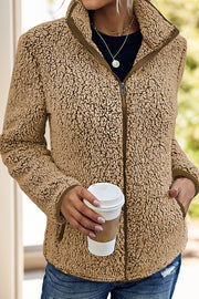 Teddy fleece zip-up jacket in camel with a stand-up collar and zip closure.