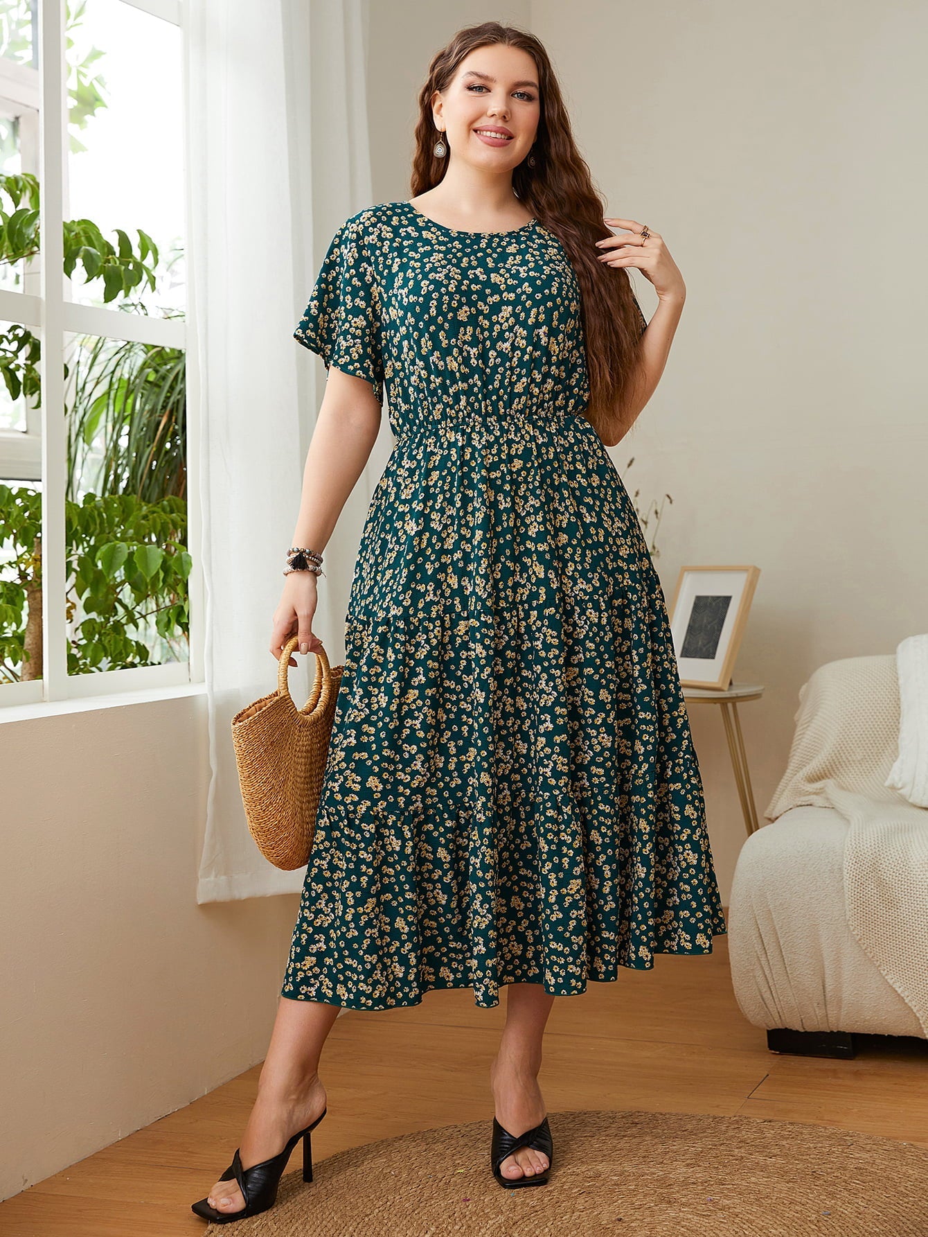 Emerald floral midi dress with tiered skirt and short sleeves.