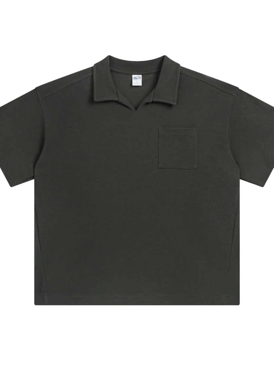 Boxy knit polo shirt in dark gray with a patch pocket and open collar.