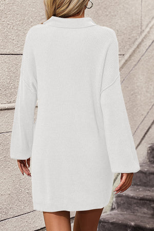 White collared knit tunic with pocket detail and bell sleeves.