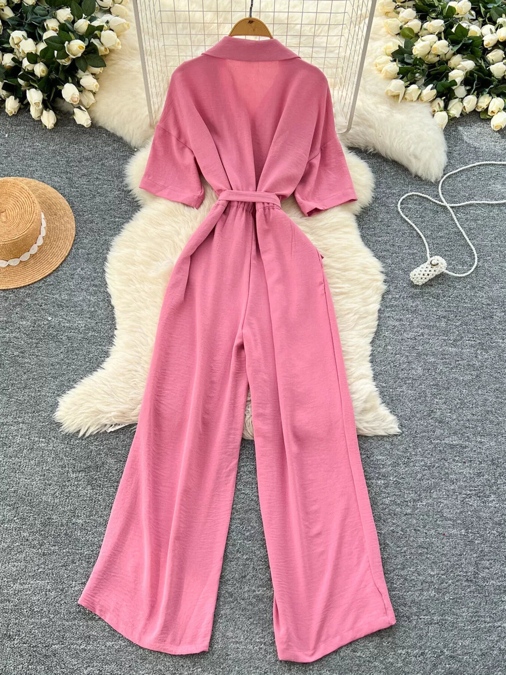 Pink belted wide-leg maternity jumpsuit with pockets and short sleeves