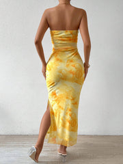 Yellow floral print ruched strapless midi dress with a thigh-high slit.