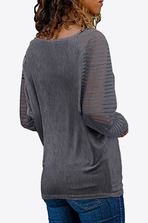 Mid Gray raglan v-neck top with striped sheer sleeves.