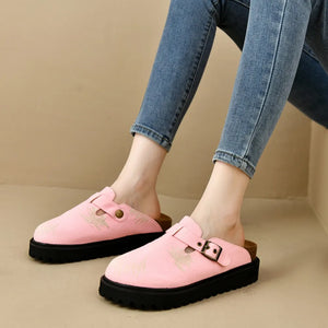 Pink embroidered denim platform clogs with buckle detail and black sole