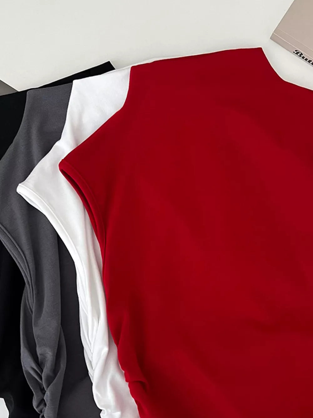 Textured ruching mock neck tank top in red, white, dark gray, and black.