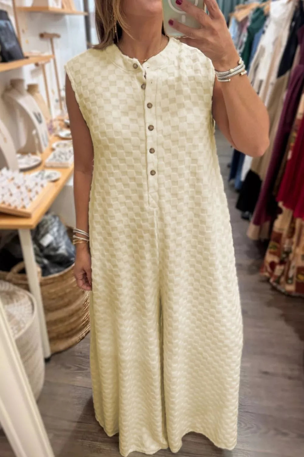 Cream checkered sleeveless wide-leg romper with band collar and button front